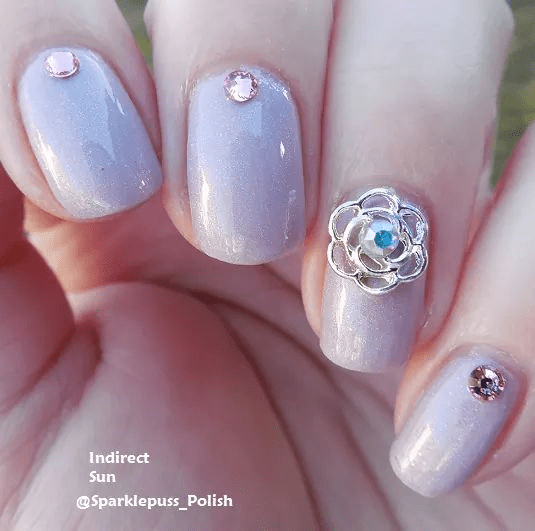 Petal To The Metal by Octopus Party Nail Lacquer with charms from Nail Art Elegance